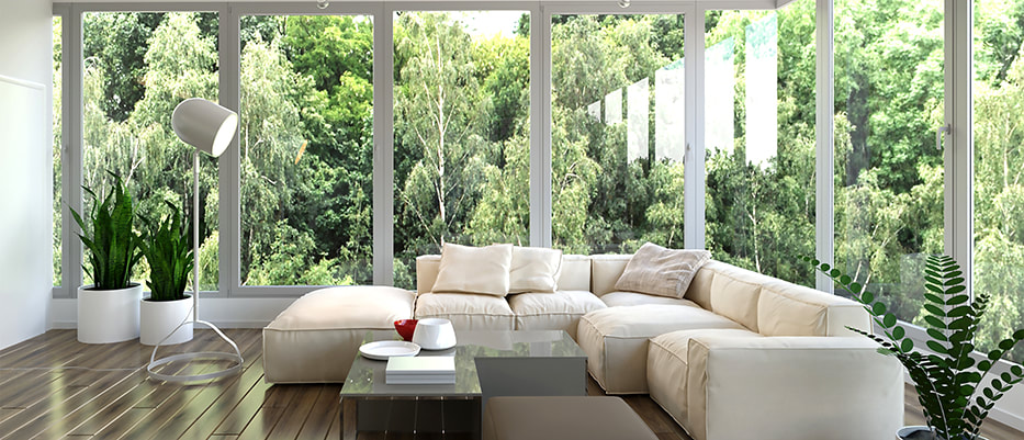 beautiful floor to ceiling windows wrapping around the room